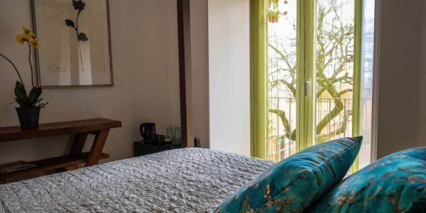 From the French doors in front of the four-poster bed you can almost reach out for these amazing fruits.