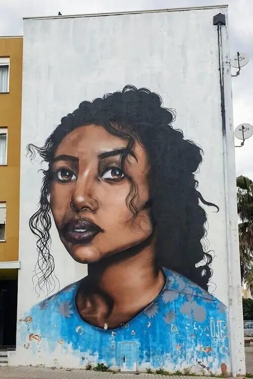 Street art by OJE in Quinta do Mocho, Lisbon
