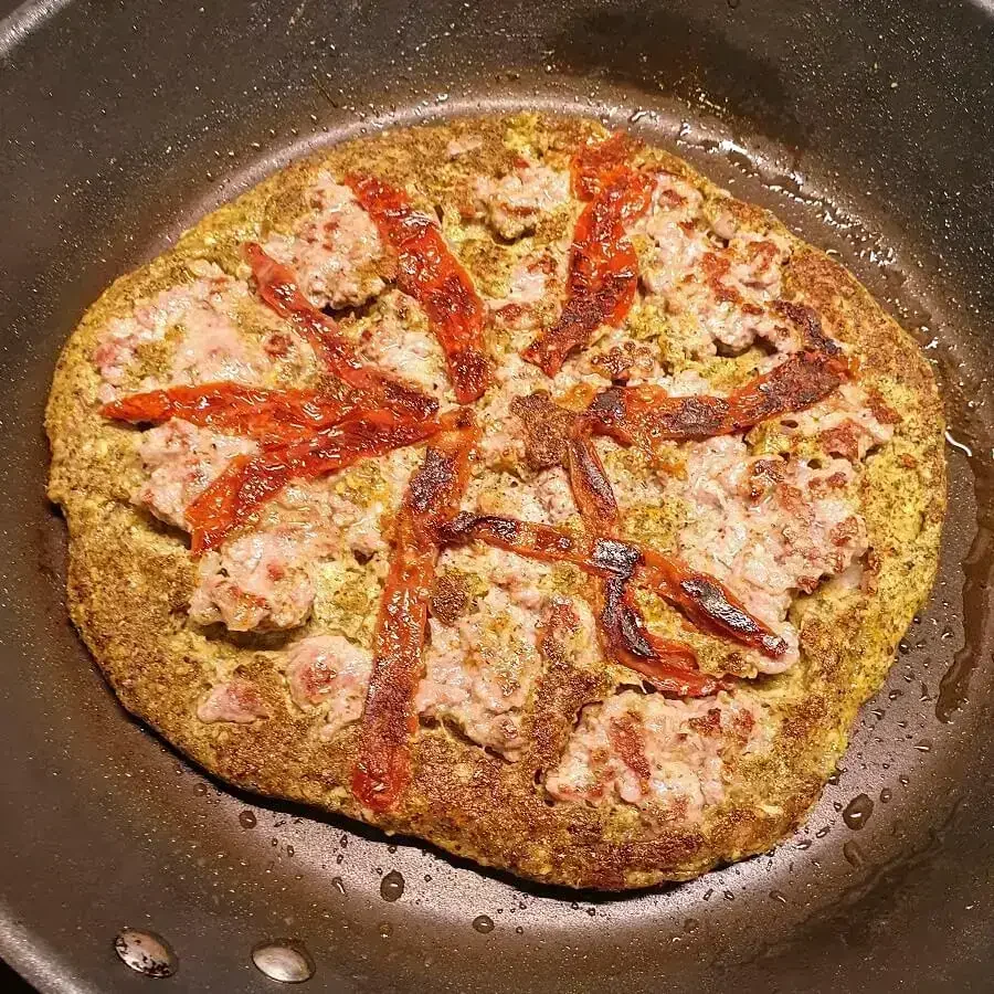 Before the meat side is done flip it, add sundried tomatoes, flip it back again and continue roasting until the meat is tender and the tomato's a bit roasted.